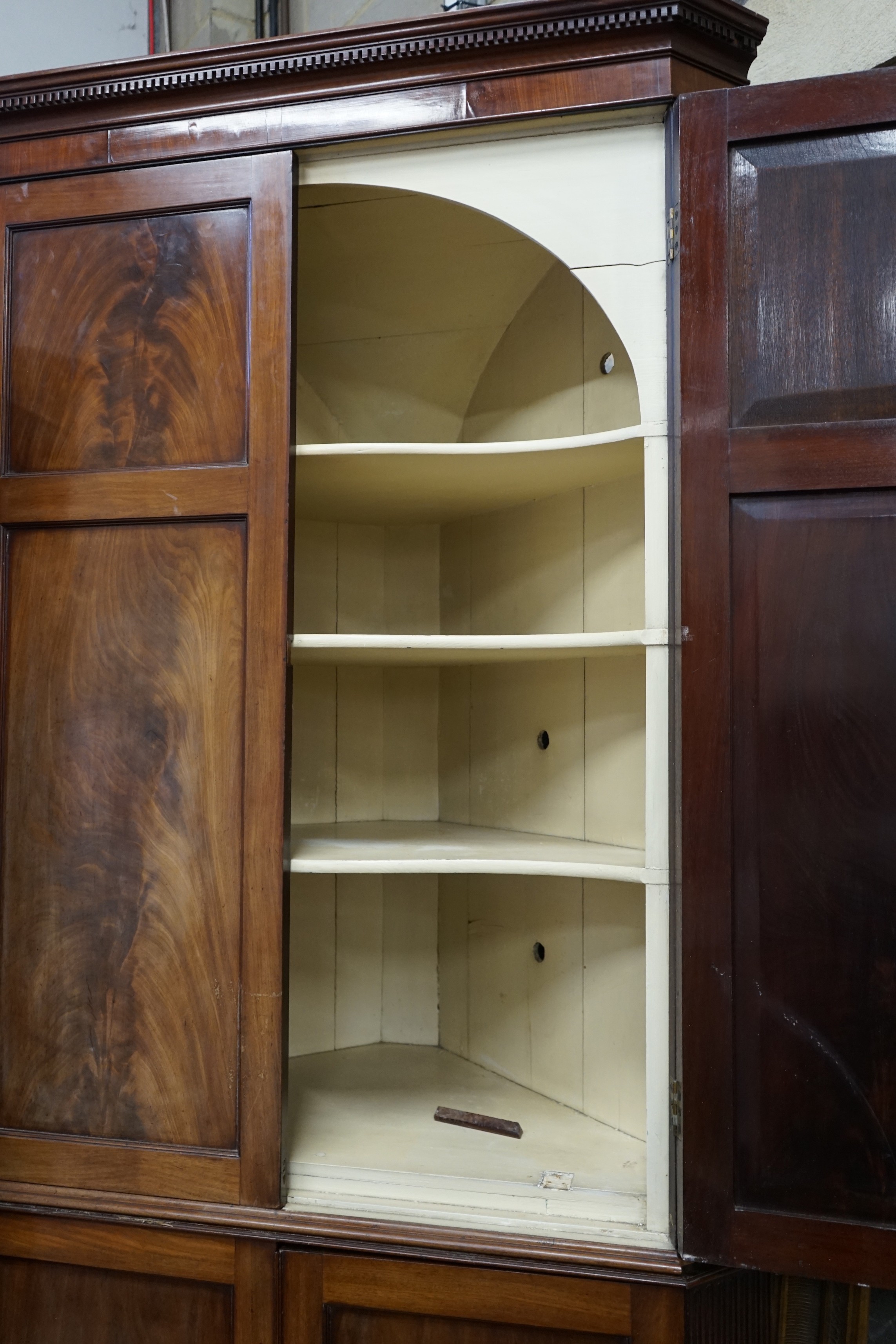 A George III mahogany standing corner cabinet, width 106cm, depth 55cm, height 228cm